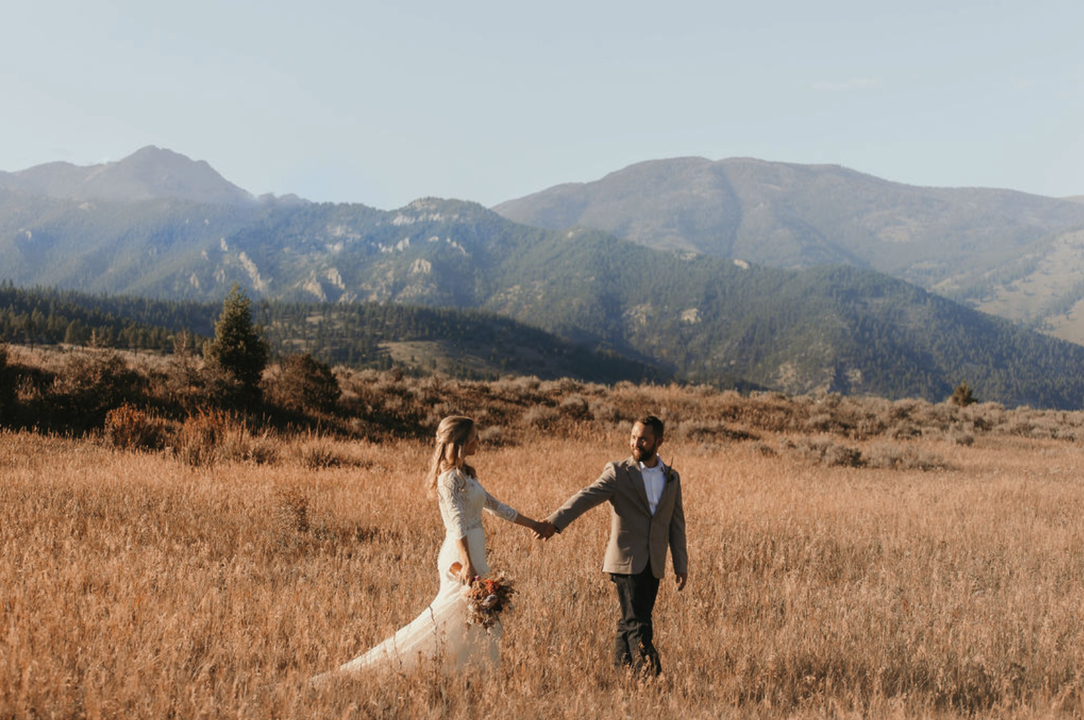 Montana couple in golden field - Full Wedding Planning